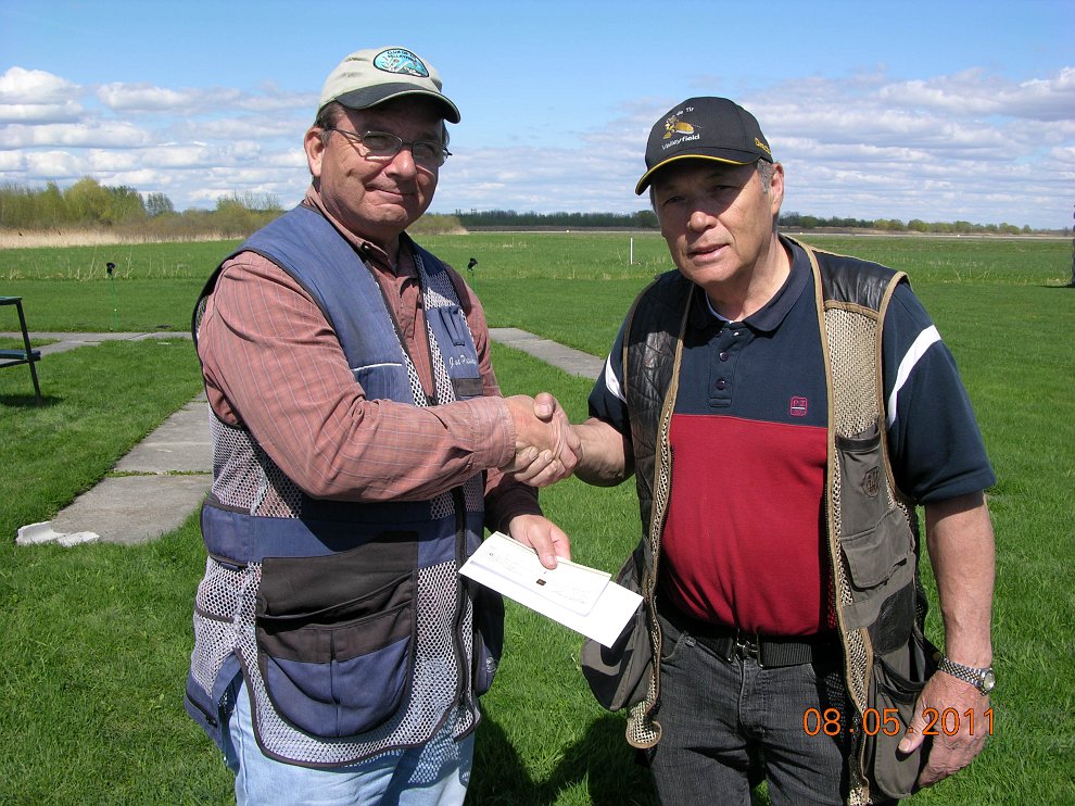 Lost target Fun Shoot 019.JPG - Joe Potosky (L) accepting a check from Marcel lebond (Representing the Quebec Trap Shooting Association) for support of the QPTA and clay target shooting in Quebec.
